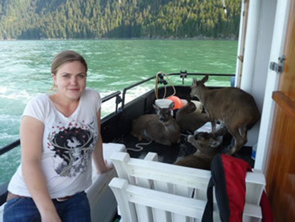 Kelly with the deer on the boat
