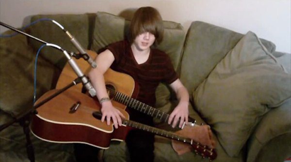 Jason Kertson performs on two guitars