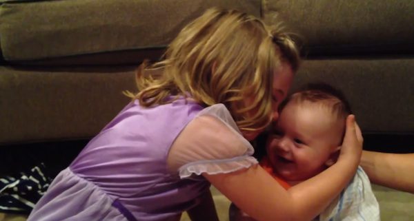 sister with baby brother