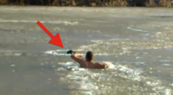 Man Uses Fists To Break Ice To Reach Stray Dog Drowning In Icy Lake