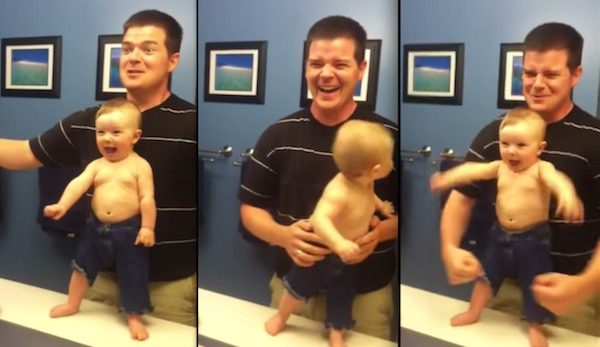 dad and baby flex together