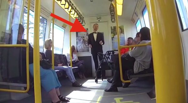 man dances on a train