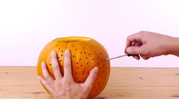 Man Pokes Holes Into A Pumpkin And Creates Something That Every Halloween Party Needs