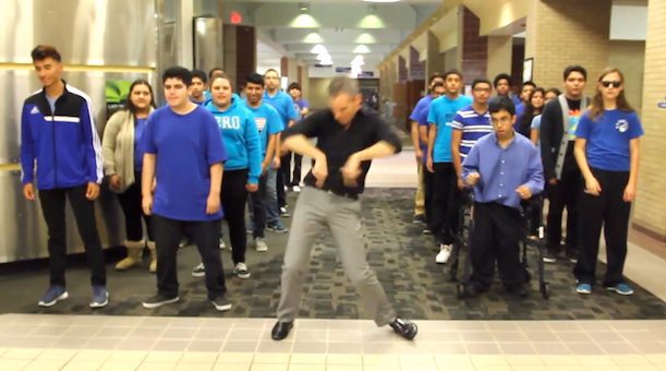 teacher dances with students