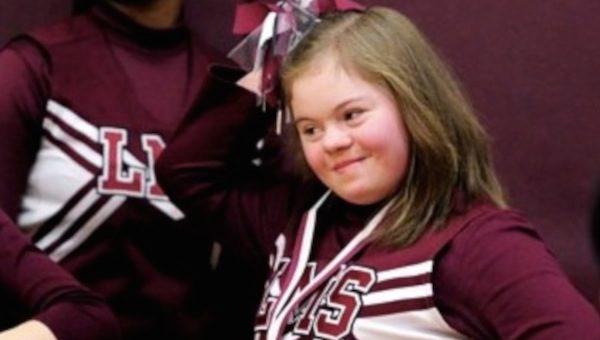 boys stand up for cheerleader