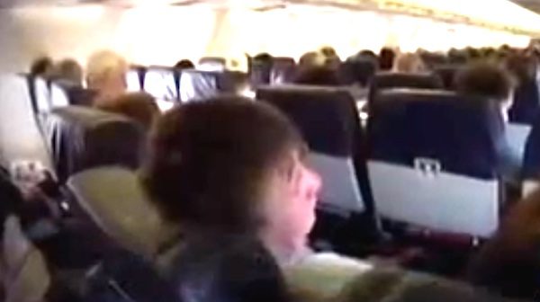 man kind to kid on flight