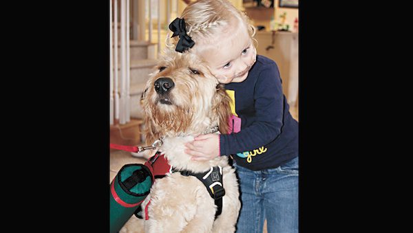 dog helps girl with oxygen