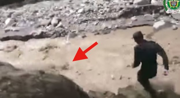 Brave Police Officer Saves Dog Being Swept Away In Flash Flood