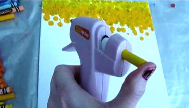 Woman Checks If You Can Paint With Crayons And A Hot Glue Gun