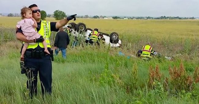 cop comforts girl