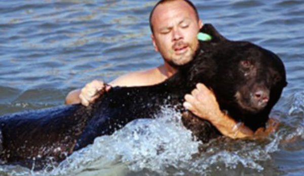 man saves bear