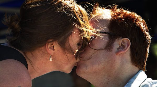 husband wife kiss