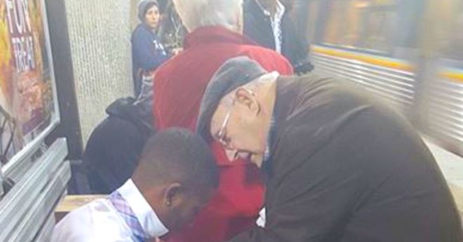 Elderly Man Helping Young Man Fix His Tie In Random Act Of Kindness