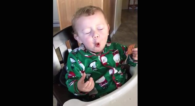 toddler eats bacon