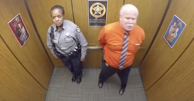 sheriff's deputy dancing in elevator