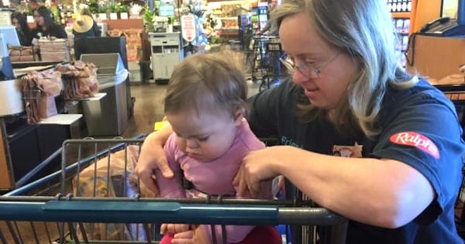 Supermarket Cashier Comforts Mother Of Daughter With Down Syndrome