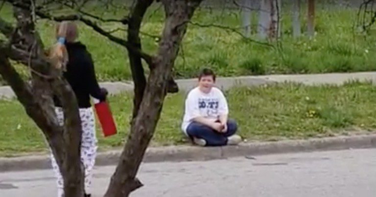girl gives boy shoes