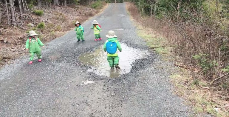 Toddlers Come Up With Their Own Game To Play In Puddle Together