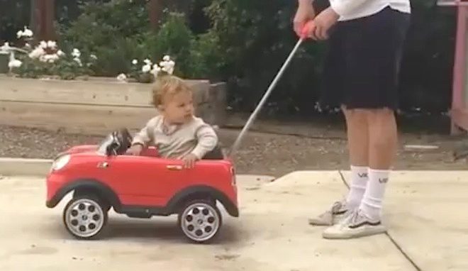 Little Boy In Toy Car Surprised By Dog’s New Ride