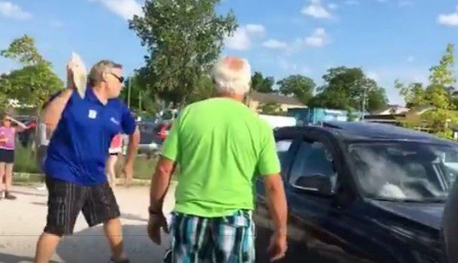 Man Throws A Large Rock At BMW’s Window To Free Dog Trapped Inside
