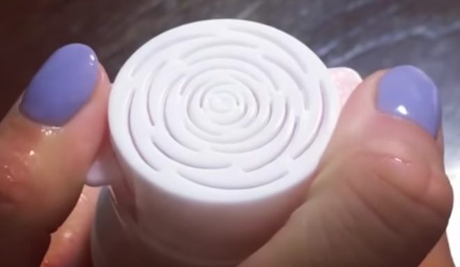 Woman Delighted When Face Wash Pump Creates Beautiful Rose From Foam