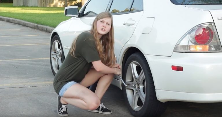 woman change tire