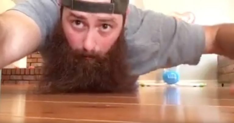 Tiny Adorable Puppy Hides In Her Human’s Beard