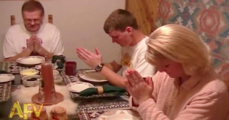 dog prays at dinner table