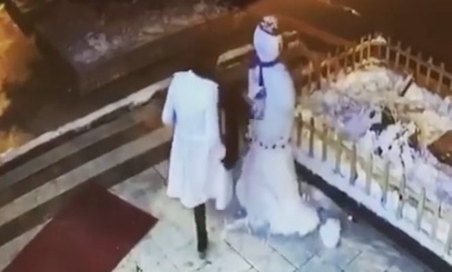 woman attacks snowman