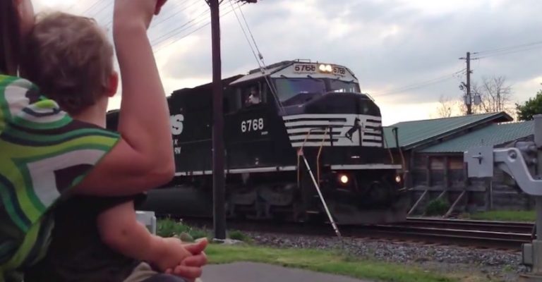toddler sees dad driving train