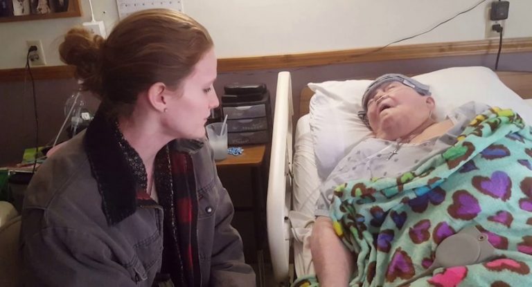nurse cares for dying patient