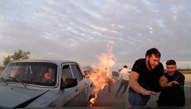 Car Dashcam Captures Bystanders Rescuing Elderly Couple Trapped In Burning Car