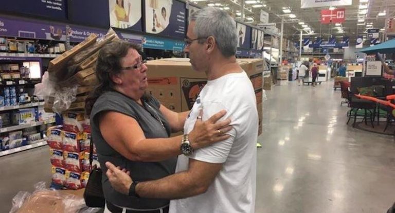 man gives generator to woman who needs it