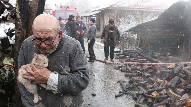 Elderly Man Hugs His Cat After His Home Burns Down