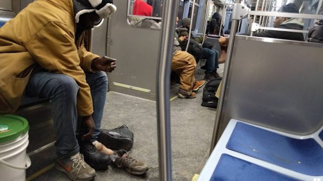 Subway Rider Gives Homeless Man The Boots Off His Feet After Seeing Tattered Shoes