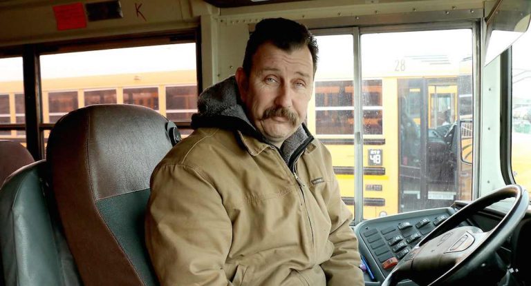 bus driver helps kid