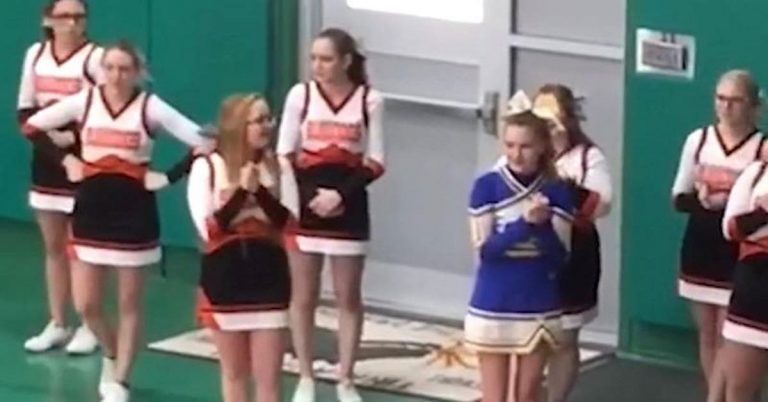 Cheerleaders Surround Girl From Rival Team Who Was Cheering All Alone