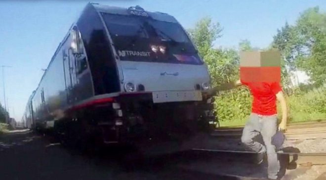 Police Officer Frantically Tries To Save Man From Being Hit By Oncoming Train