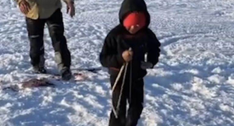 Boy Ice Fishing Catches Huge Fish As Big As Him