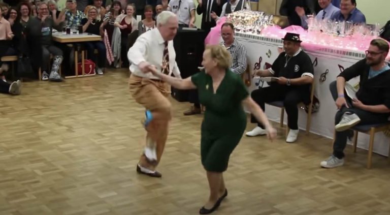Senior Couple Boogie Their Hearts Out In Front Of Amazed Crowd