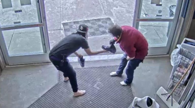 woman gives her shoes to homeless man