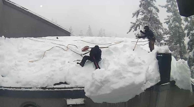 Worker Doing Snow Removal On Roof Removes Himself Too