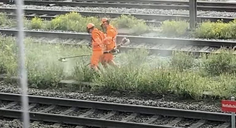 Workers dance at railway