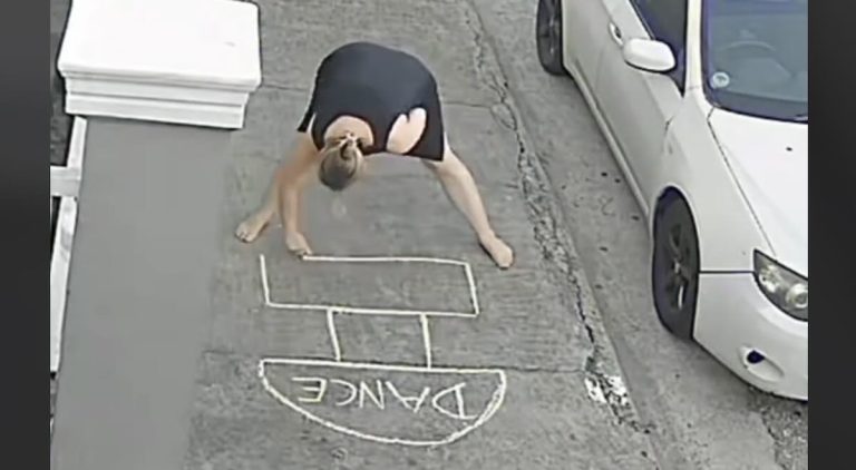 Woman puts hopscotch game in front of her house for Mardi Gras